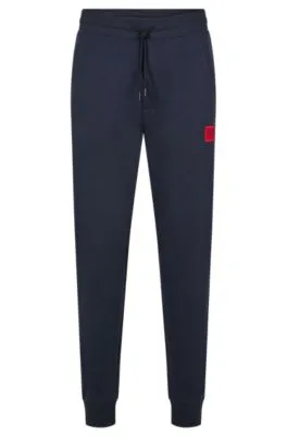 Cotton-terry tracksuit bottoms with red logo label