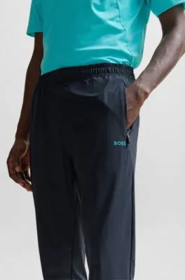 Regular-fit tracksuit bottoms with decorative reflective artwork